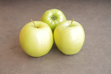 green apples on a yellow background