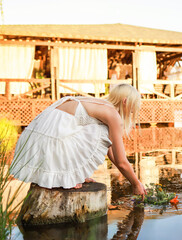 On Ivan Kupala, a girl makes a wish and throws a wreath into the river.