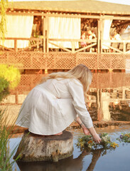 On Ivan Kupala, a girl makes a wish and throws a wreath into the river.