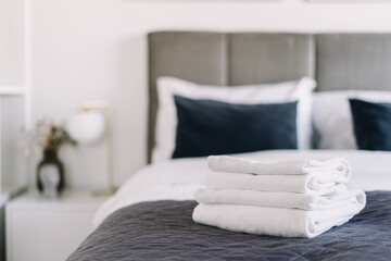 Comfortable hotel suite with modern decor and bedding for a relaxing morning