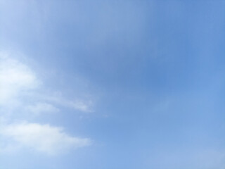 Bright sky background texture. Daytime air, bright blue sky and white clouds