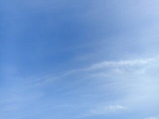 Bright sky background texture. Daytime air, bright blue sky and white clouds