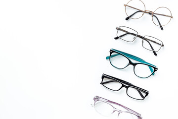 Many different styles of eyeglasses with lenses on white. Eye care and protection concept
