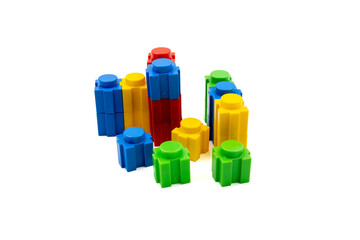 Colorful stacked plastic building blocks on white background