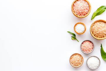 Spa composition with many different kinds of sea salt in bowls, top view