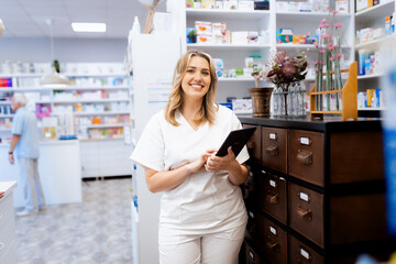 Portrait of female pharmacist in drugstore.