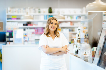 Portrait of female pharmacist in drugstore.