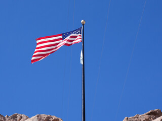 Las Vegas, Nevada, USA. November 19, 2024: American flag at Hoover Dam famous dam on the border of Arizona and Nevada