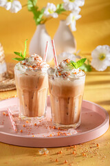Tasty ice coffee served with glass and straw.