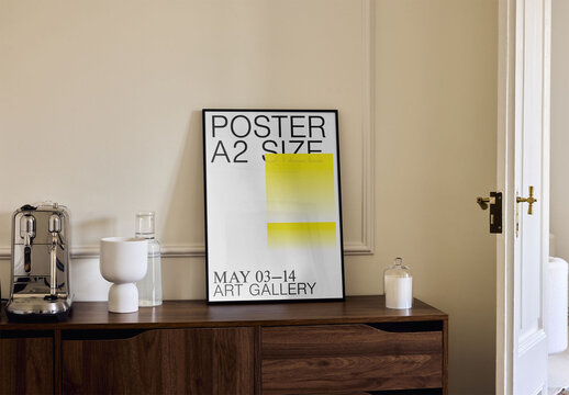 Mockup Of Vertical Customizable A2 Framed Poster On Sideboard