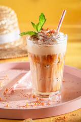 Tasty ice coffee with whipped cream and sprinkles.