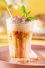 Sweet ice coffee with whipped cream and sprinkles.