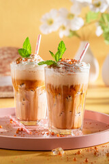 Homemade ice coffee with whipped cream and sprinkles.
