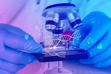 Scientist hands with gloves analyzing DNA under microscope with futuristic biotechnology medical research graphics