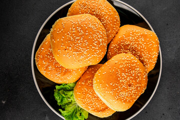 Bun burger puffy soft buns baking fresh delicious gourmet food background on the table rustic food...