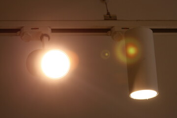 A pair of lights mounted on a wall, suitable for use in various settings