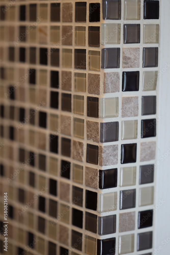 Poster a detailed view of a tiled countertop with various colors and textures