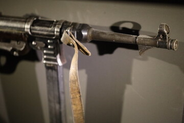 A close-up shot of a gun with a wooden handle, ready for use