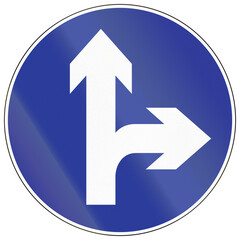 Road sign in China - Proceed straight or Turn right
