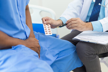 Doctor gives medication advice to a male patient with symptoms of sexual dysfunction, Male health...
