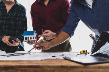Collaboration architects team brainstorming discuss construction project design blueprints on...