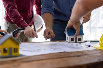 Collaboration architects team brainstorming discuss construction project design blueprints on...