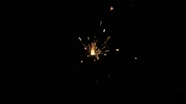 Fiery sparks burst illuminating the dark, dynamic visual effect, intense energy, perfect for explosive backgrounds.