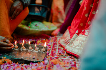 Ritual lighting ceremony. A traditional ritual with lamps and colorful flowers. The ceremony...