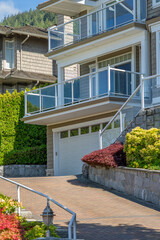 Garage door in luxury house with trees and nice landscape in Spring in Vancouver, Canada, North...