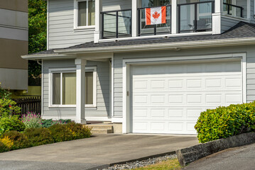 Garage door in luxury house with trees and nice landscape in Spring in Vancouver, Canada, North...