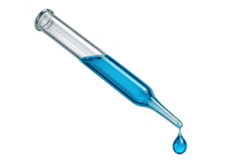 Glass dropper with blue liquid and falling drop, isolated subject.