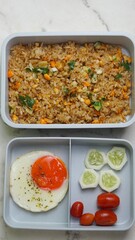 lunch bento box set of egg, fried rice and vegetables