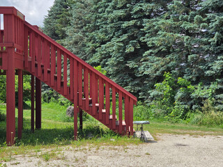 Red Barn with Historic Horse Carriage in Rural Setting