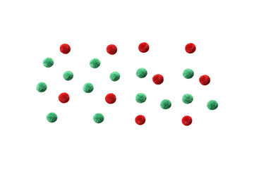 Scattered red and green fuzzy pom-poms in festive Christmas colors, craft supplies for decorating, isolated on a transparent background