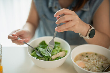 Woman Enjoying Fresh Salad and Warm Soup at Home Table, Healthy Eating Lifestyle, Casual Dining Atmosphere with Natural Light