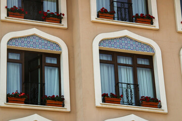 Traditional façade in Istanbul with arched windows and Middle Eastern details. A blend of Islamic...