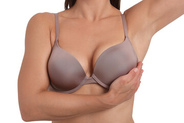 Woman wearing beautiful beige bra on white background, closeup