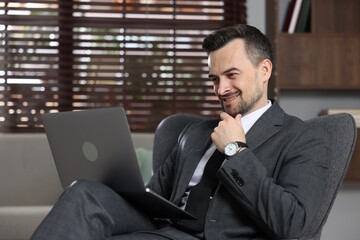 Professional psychologist having online consultation with his client via laptop indoors