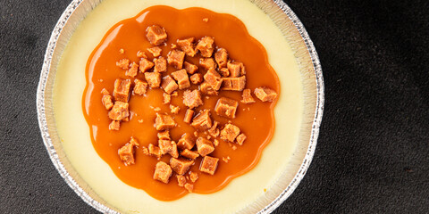 Cheesecake salted caramel sweet dessert fresh delicious gourmet food background on the table rustic food top view copy space