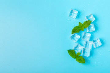 Mint and ice on texture background. Green fresh mint and ice cube. Mint leaves, ice cube and water...