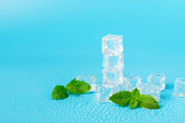 Mint and ice on texture background. Green fresh mint and ice cube. Mint leaves, ice cube and water...
