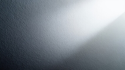 A textured gradient surface with a beam of light shining from the upper right corner of the frame