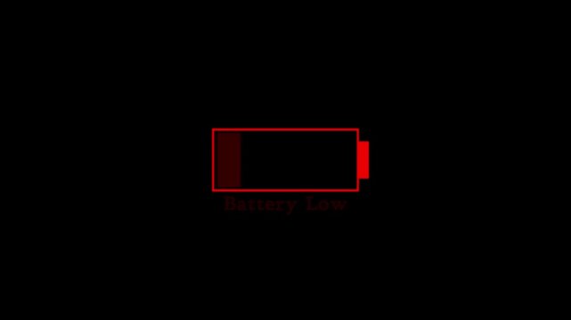 simple animation red and shine low battery indicator in black background, Glowing battery animation on black background.