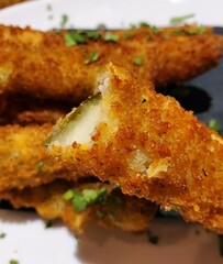 Closeup of a perfectly fried golden pickles