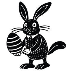 Black bunny holding striped egg black and white rabbit