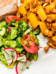 Vibrant vegetable medley with fresh salad and potatoes