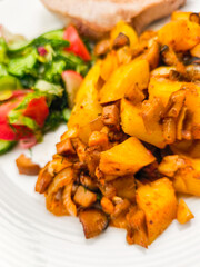 Delicious roasted vegetables with fresh salad