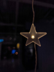 Glowing star shaped light in dark ambience
