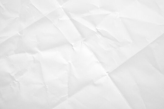 White folded and wrinkled paper texture background