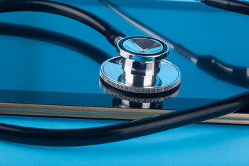Stethoscope tablet on a blue background.